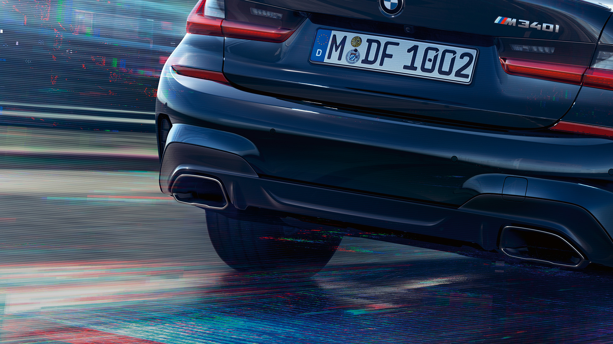 Uitlaateindpijpen BMW M340i xDrive Sedan Uitlaateindpijpen BMW M340i xDrive Sedan G20 Saphir Schwarz metallic close-up