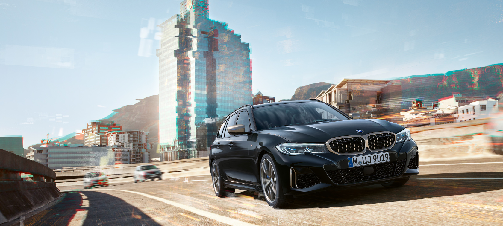 BMW M340i xDrive Touring, driekwart vooraanzicht voor stad BMW M340i xDrive Touring, driekwart vooraanzicht voor stad
