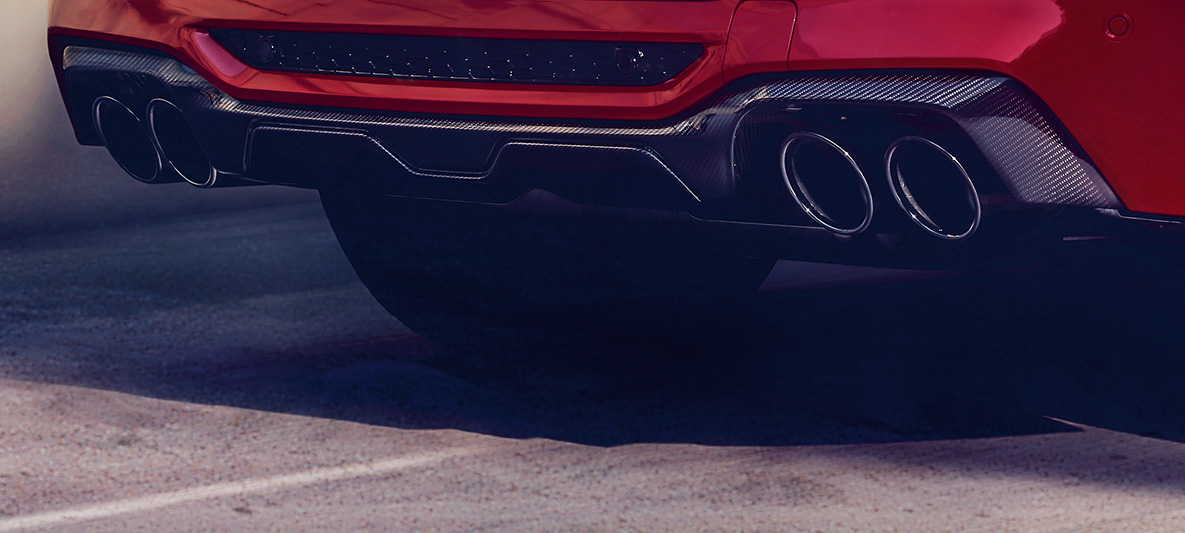 BMW X4 M Competition, achterdiffusor in Carbon. BMW X4 M Competition in Toronto Rot metallic, exterieur, M Carbon exterieurpakket, achterdiffusor in Carbon.